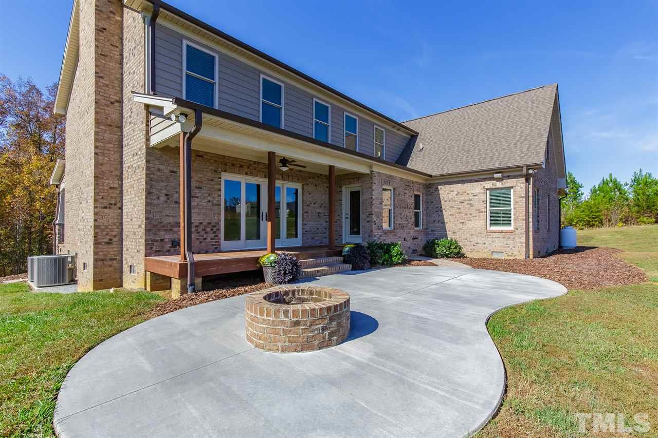 2514 Rogers Road Graham, NC 27253 - Photo 28 of 30 Kidney shaped patio with built-in firepit