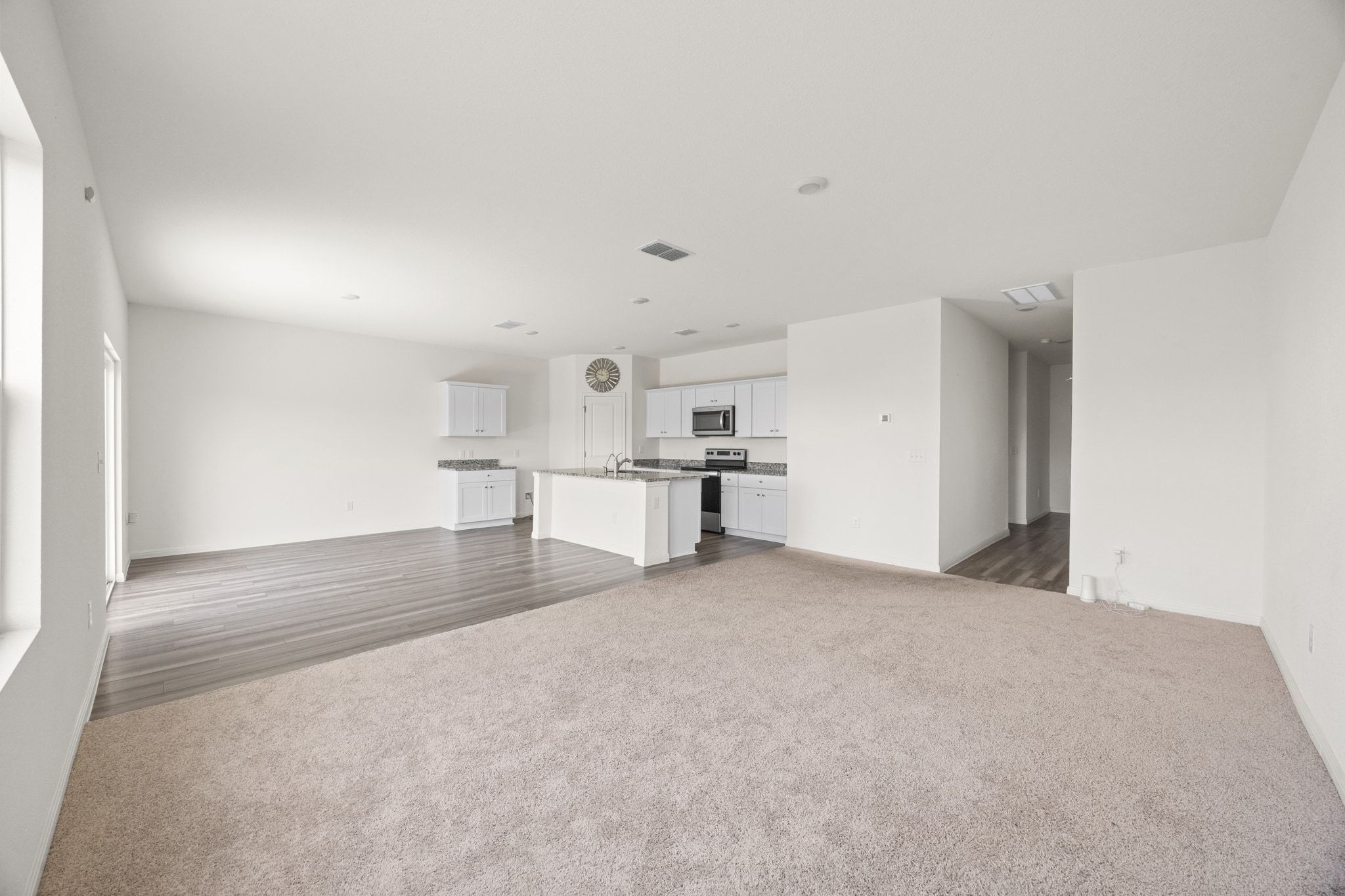 410 Magnum Force Drive Jarrell, TX 76537 - Photo 11 of 32 a view of empty room with kitchen