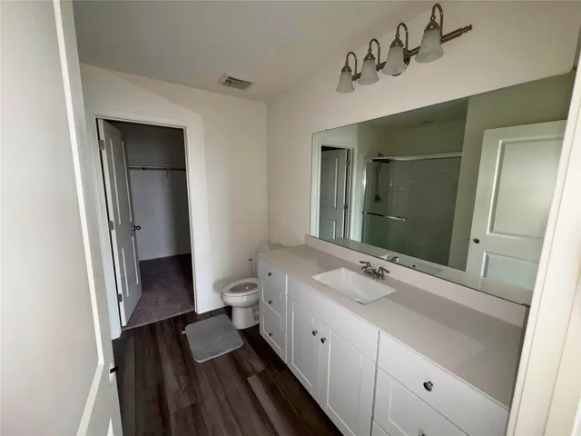 a bathroom with a sink and a shower