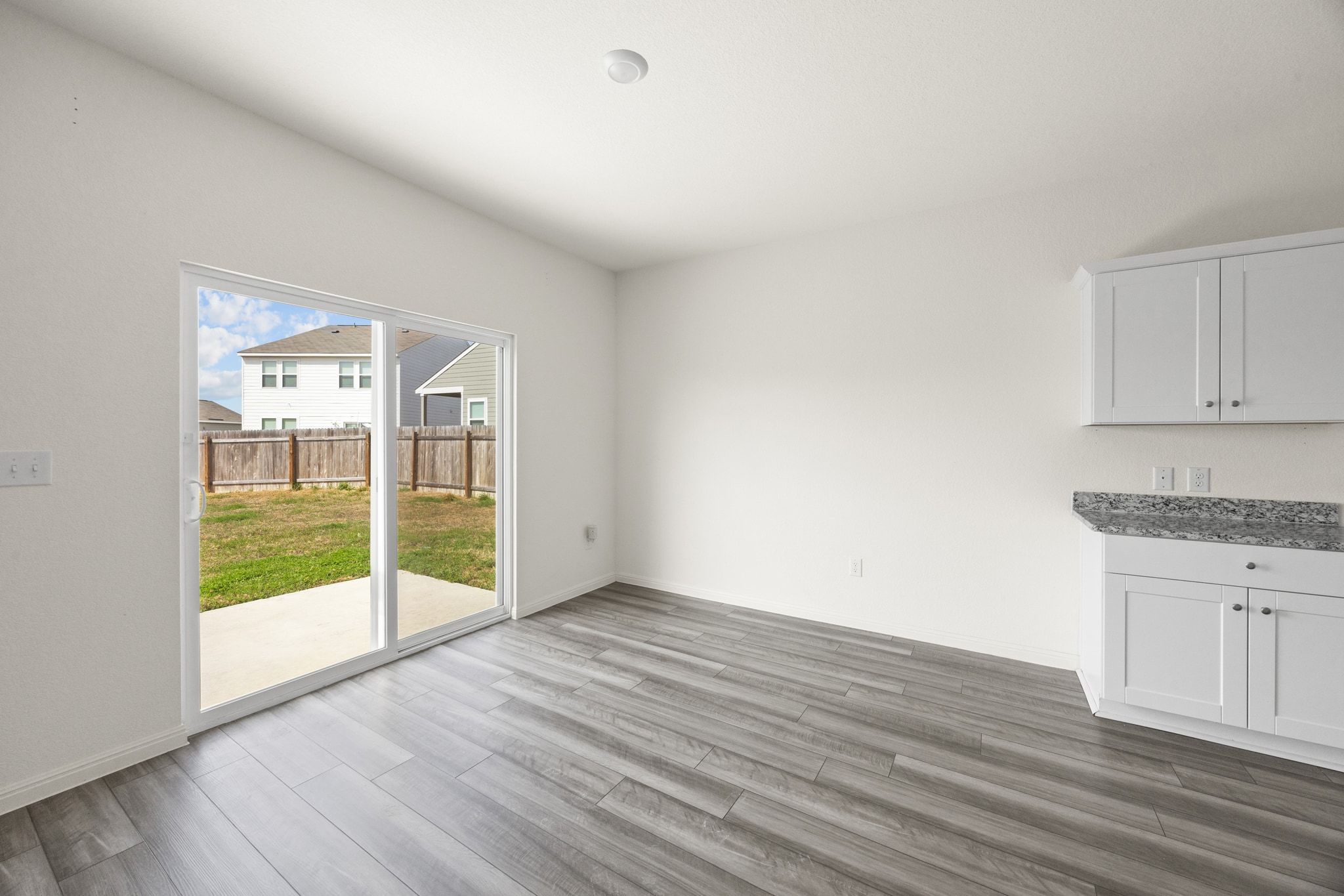 410 Magnum Force Drive Jarrell, TX 76537 - Photo 17 of 32 wooden floor in an empty room with a window