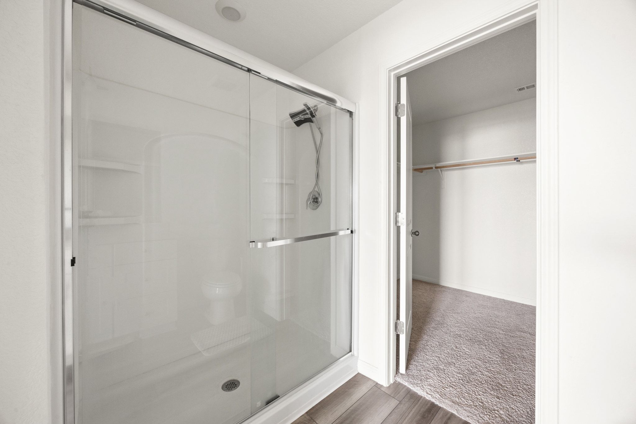 410 Magnum Force Drive Jarrell, TX 76537 - Photo 24 of 32 a bathroom with a glass shower door