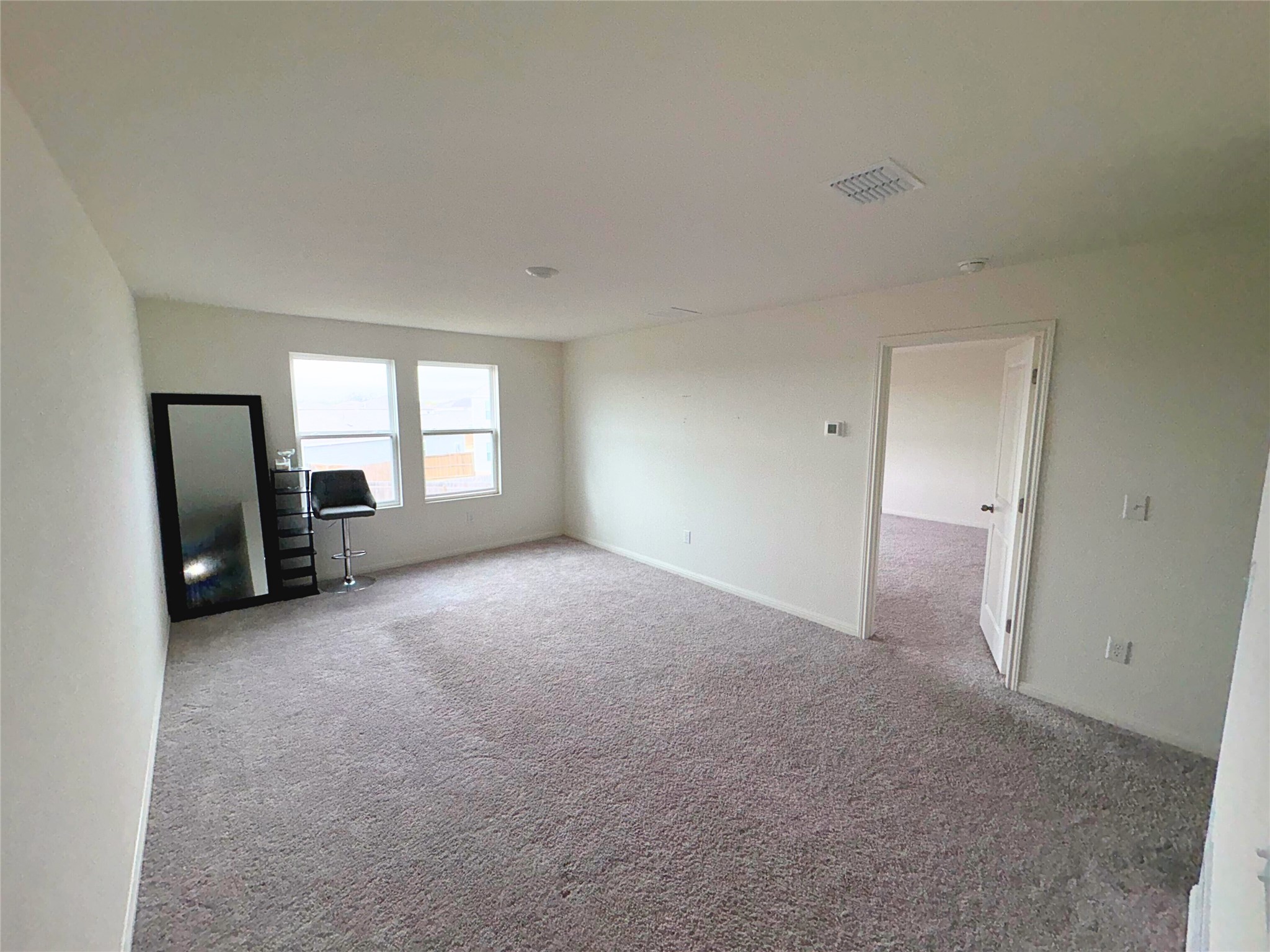410 Magnum Force Drive Jarrell, TX 76537 - Photo 7 of 18 Unfurnished living room featuring carpet floors