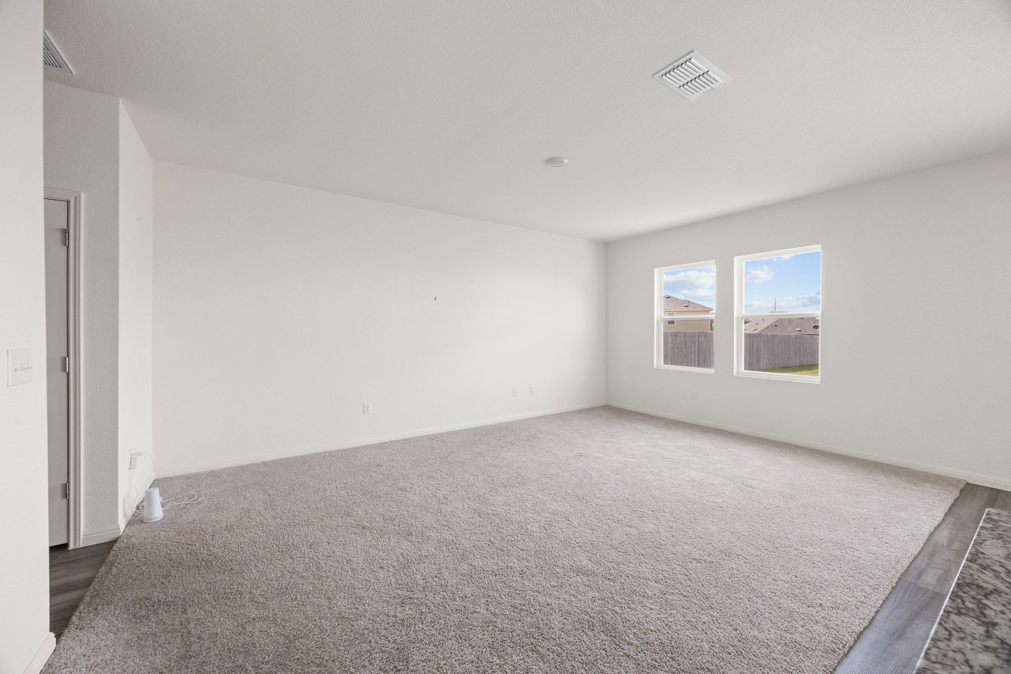 410 Magnum Force Drive Jarrell, TX 76537 - Photo 9 of 32 an empty room with windows