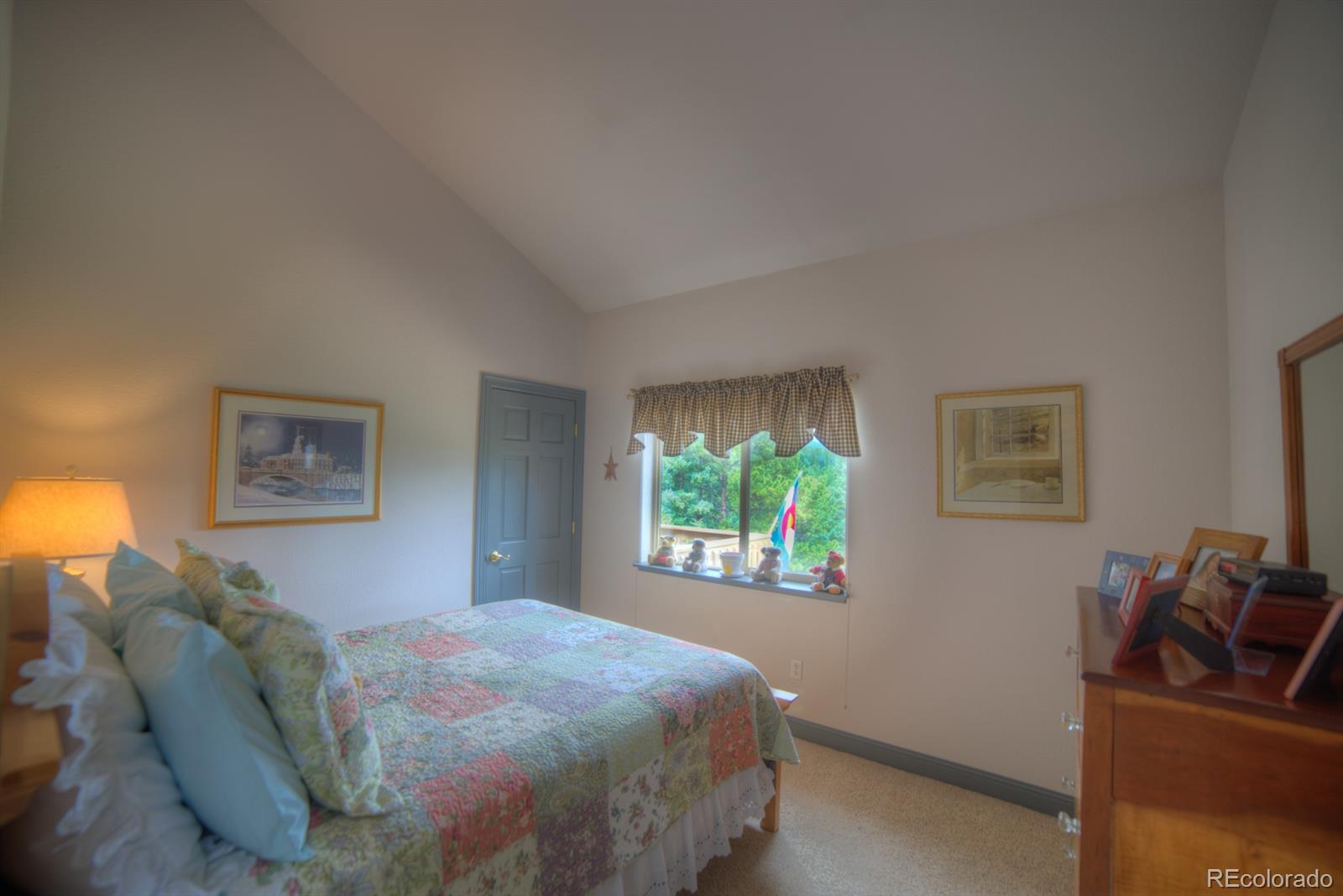 264 Hangmans Road Bailey, CO 80421 - Photo 13 of 33 a bedroom with a bed and a couch
