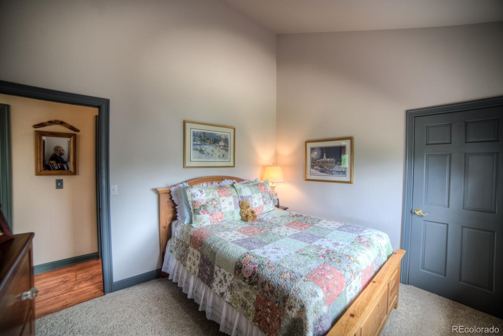 264 Hangmans Road Bailey, CO 80421 - Photo 14 of 33 a bedroom with a bed and a painting on the wall