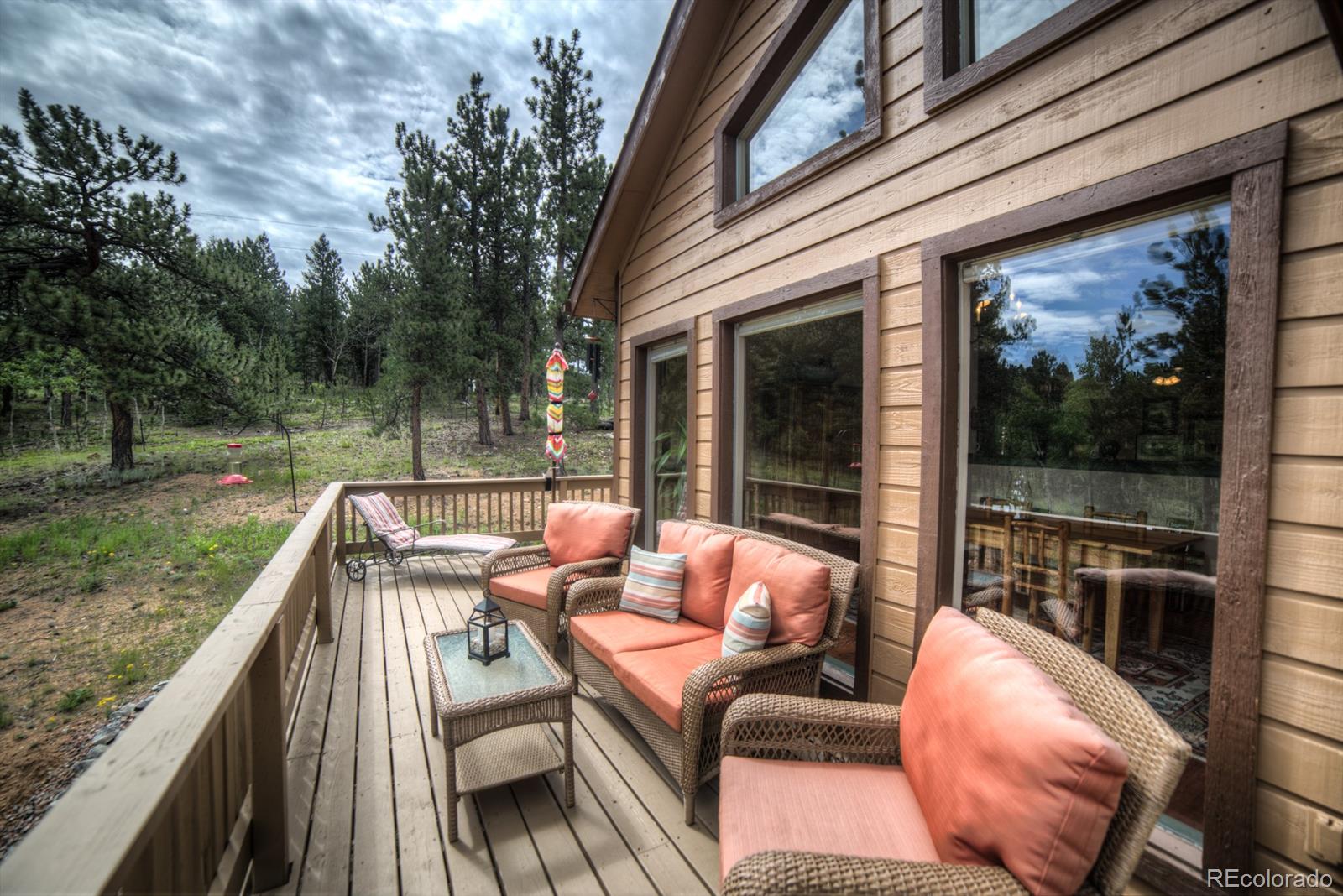 264 Hangmans Road Bailey, CO 80421 - Photo 28 of 33 a view of a roof deck with couches and wooden floor