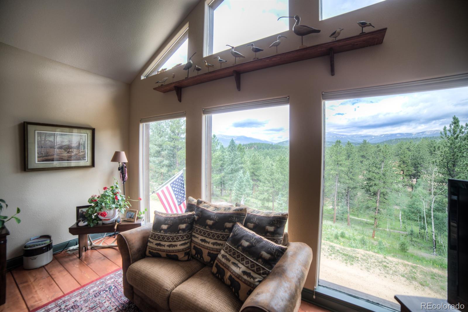 264 Hangmans Road Bailey, CO 80421 - Photo 7 of 33 a living room with furniture and a large window