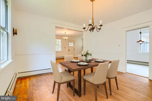 a view of a room with wooden floor and windows