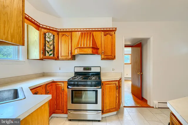 a kitchen with stainless steel appliances granite countertop a sink and cabinets
