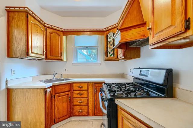 a view of a room with wooden floor and wall painting