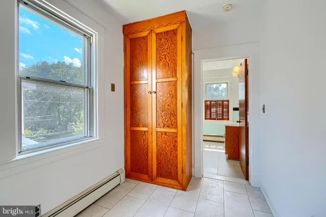 a view of kitchen with wooden floor and electronic appliances