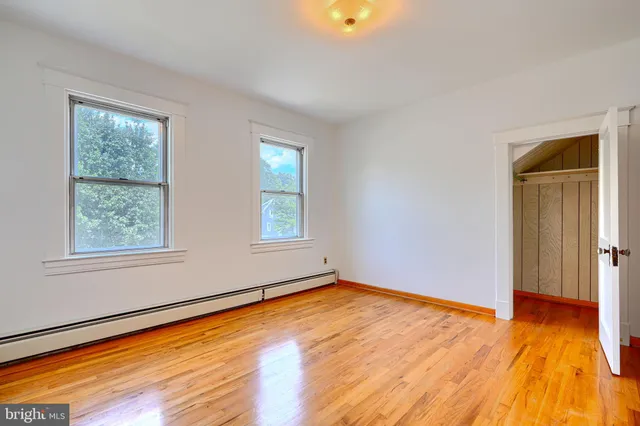 a bathroom with a glass door shower