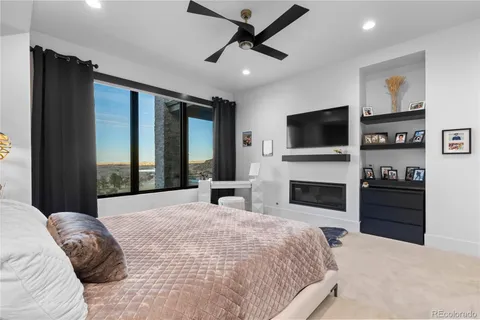 a bedroom with a bed and a couch