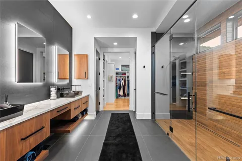 a bedroom with a bed and a mirror