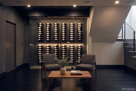 a living room with furniture and a bookshelf