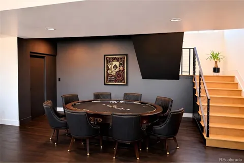 a view of an empty room with a floor to ceiling window and an outdoor kitchen
