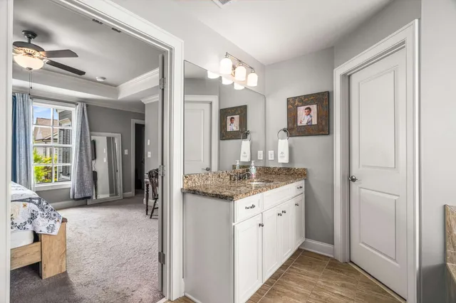 a room with a sink and a mirror