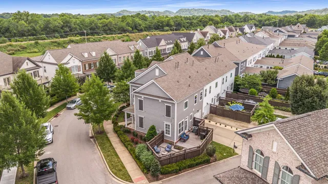 an aerial view of residential house with outdoor space and river