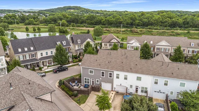 an aerial view of a house with a lake view