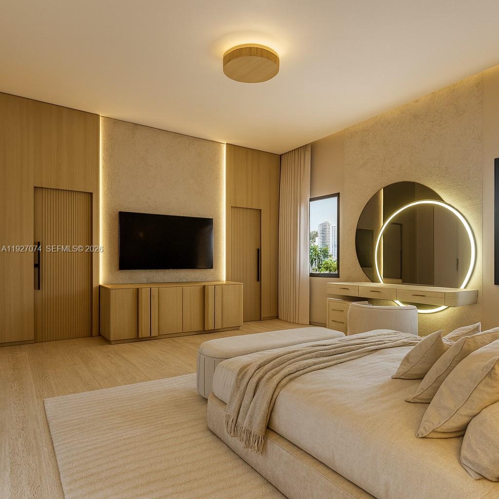 2610 Northeast 48th Street Lighthouse Point, FL 33064 - Photo 17 of 25 a bedroom with a bed and a flat screen tv