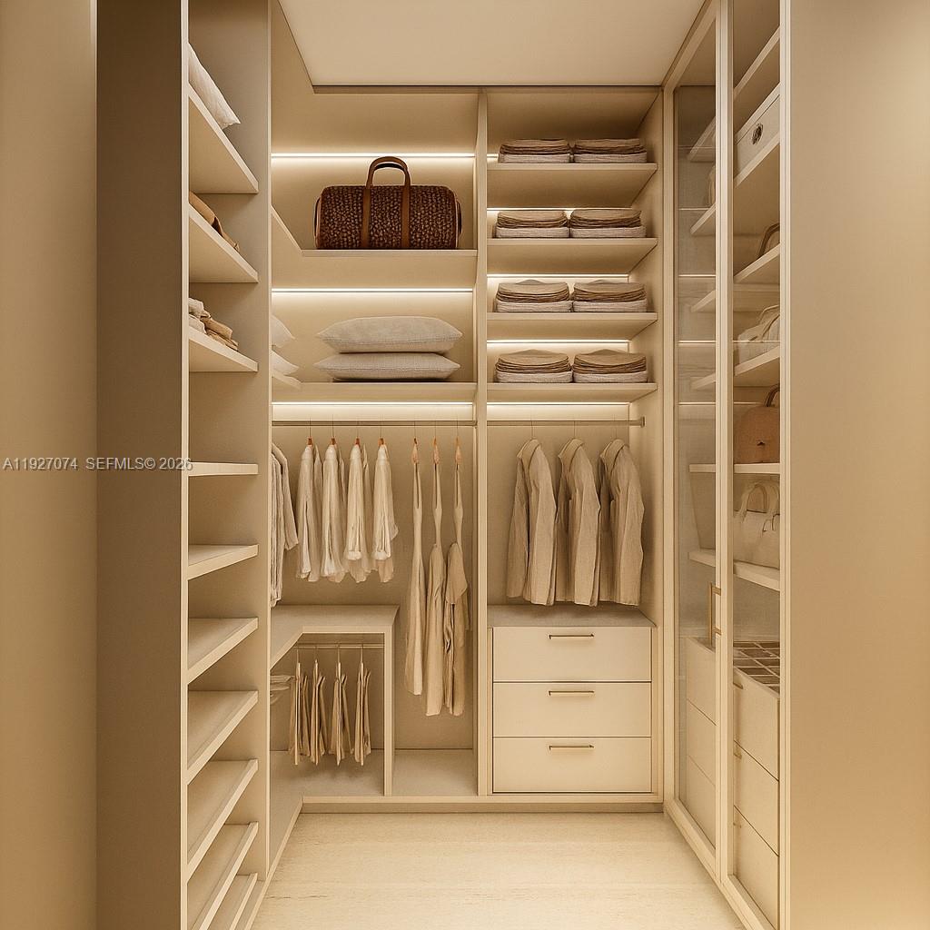 2610 Northeast 48th Street Lighthouse Point, FL 33064 - Photo 18 of 25 a view of walk in closet with empty racks