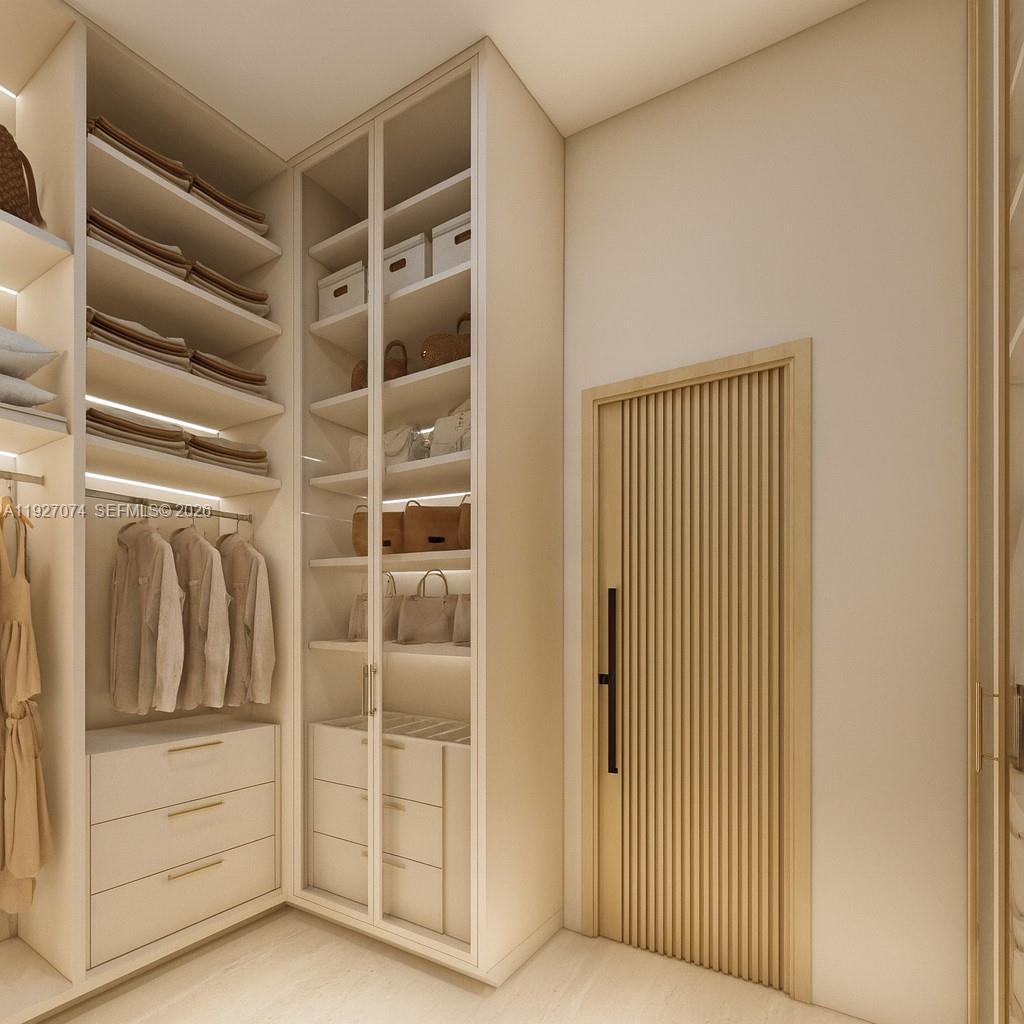 2610 Northeast 48th Street Lighthouse Point, FL 33064 - Photo 19 of 25 a view of walk in closet with empty racks
