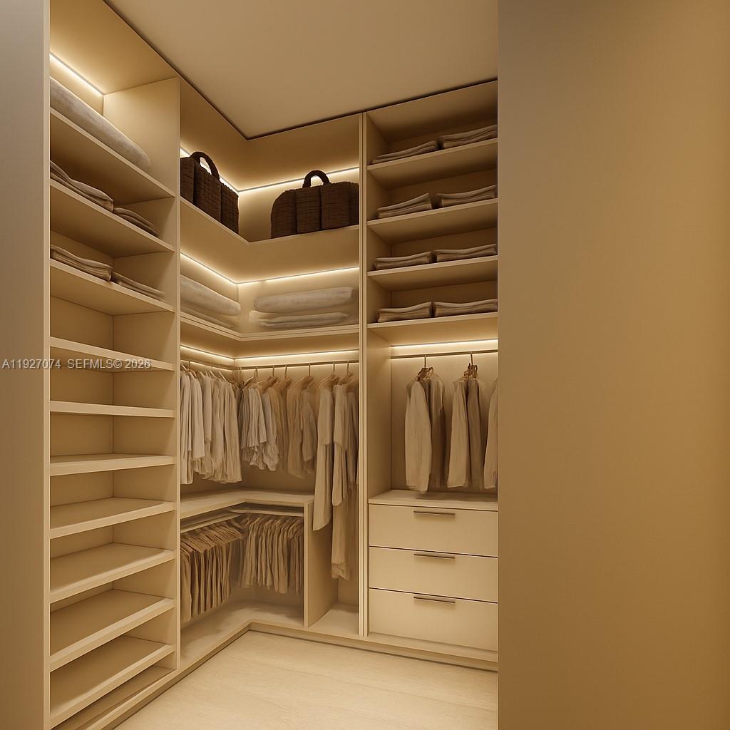 2610 Northeast 48th Street Lighthouse Point, FL 33064 - Photo 7 of 25 a view of walk in closet with empty racks