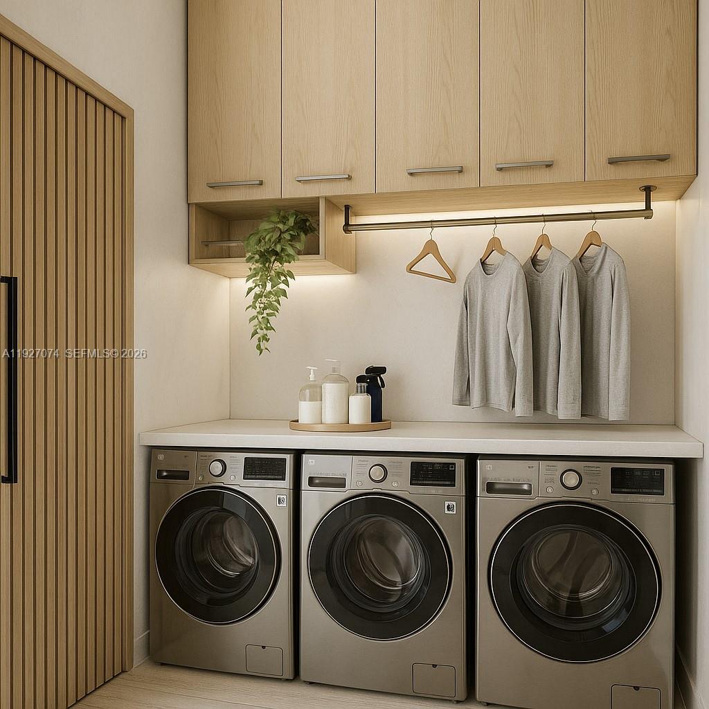2610 Northeast 48th Street Lighthouse Point, FL 33064 - Photo 9 of 25 a utility room with dryer and washer