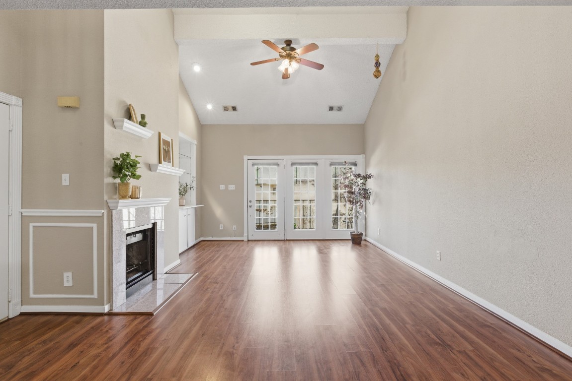 2425 Holly Hall Street, Unit 100 Houston, TX 77054 - Photo 11 of 45 Light pours in through the wall of windows and window paned door.