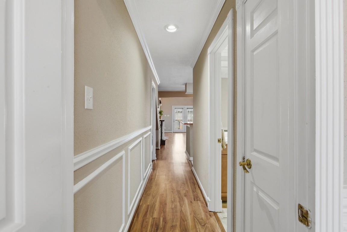2425 Holly Hall Street, Unit 100 Houston, TX 77054 - Photo 22 of 45 Lovely picture frame wainscoting through hallway and stairway walls.