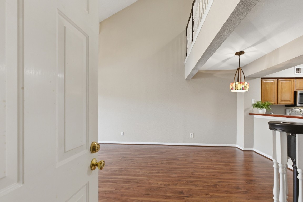 2425 Holly Hall Street, Unit 100 Houston, TX 77054 - Photo 34 of 45 Door off of living area leading to stairs to garage.