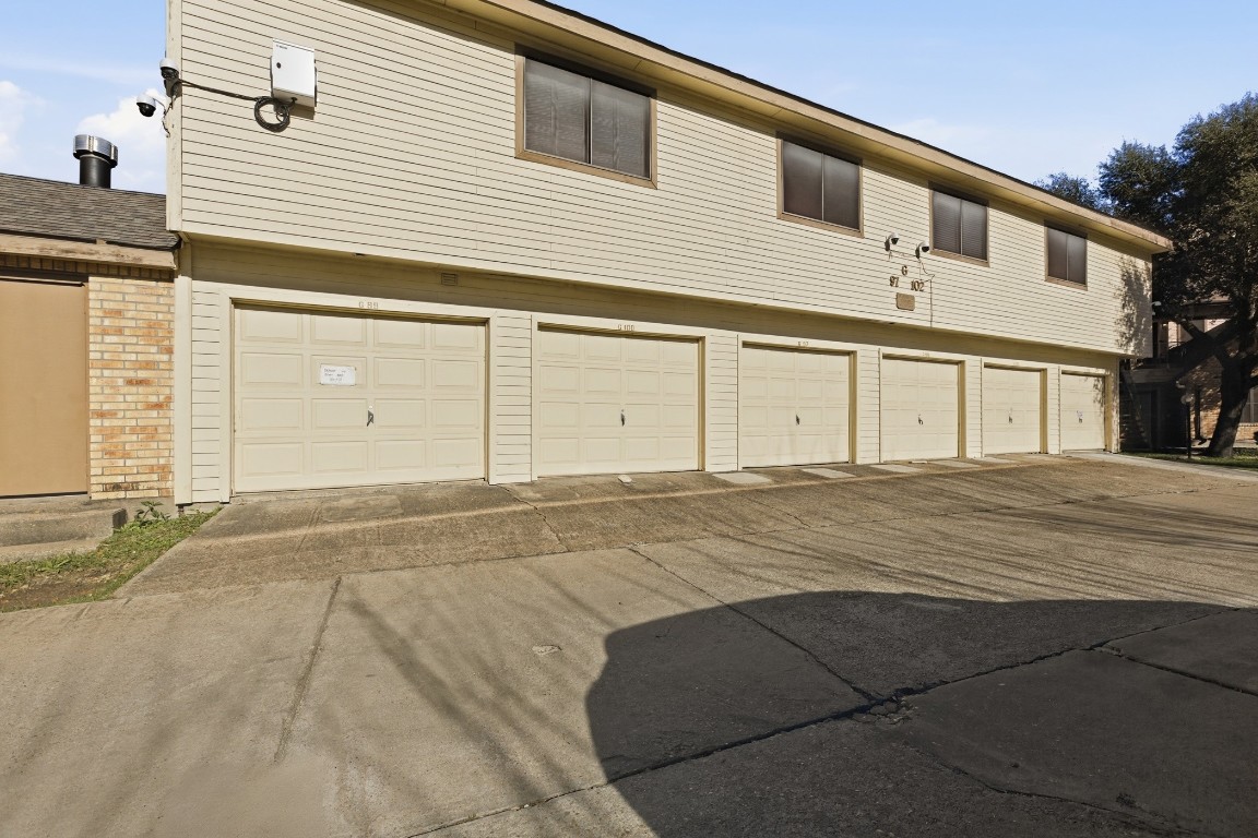 2425 Holly Hall Street, Unit 100 Houston, TX 77054 - Photo 36 of 45 Automatic single car garage. There is an additional unassigned parking space in the complex.