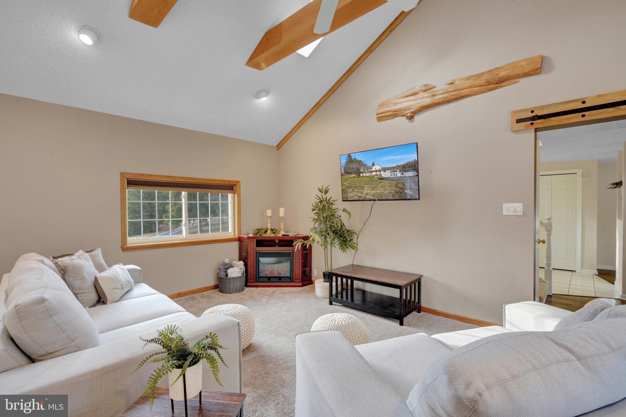 259 A A-Frame Road Coudersport, PA 16915 - Photo 23 of 130 Cozy living space with natural light.