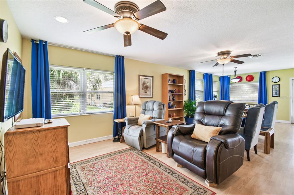 87 Lone Star Street Umatilla, FL 32784 - Photo 18 of 59 a living room with furniture and a large window