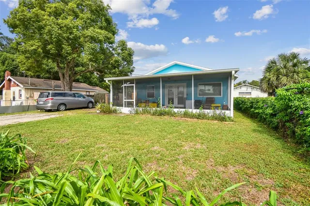 a front view of a house with a yard table and chairs