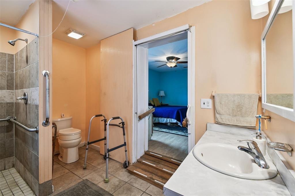 87 Lone Star Street Umatilla, FL 32784 - Photo 39 of 59 a bathroom with a sink toilet and shower