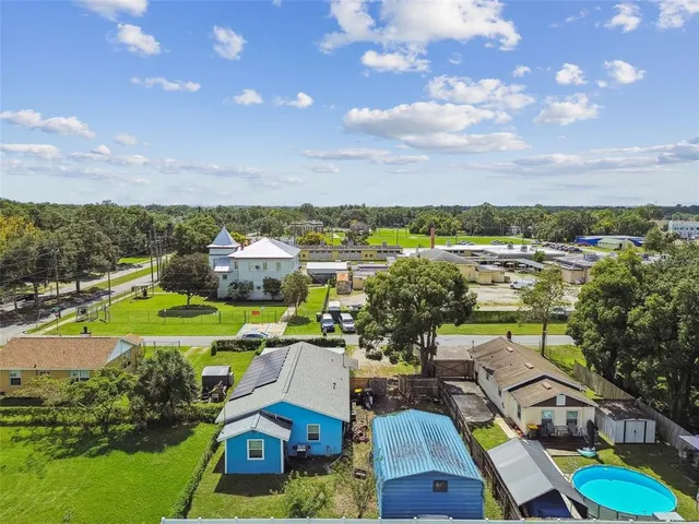 a front view of a house with a yard table and chairs