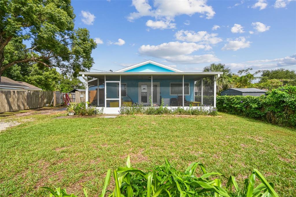 87 Lone Star Street Umatilla, FL 32784 - Photo 56 of 59 a view of a house with backyard and garden