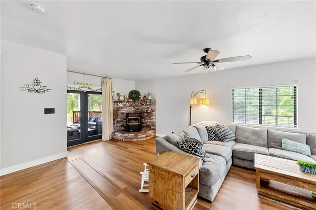 a bedroom with a bed and a ceiling fan