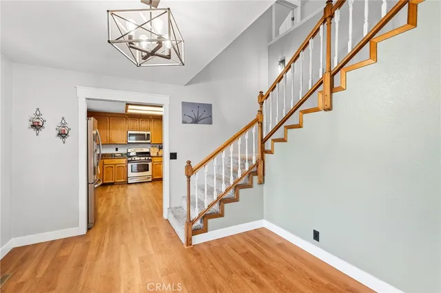 a bathroom with a granite countertop sink toilet mirror and shower