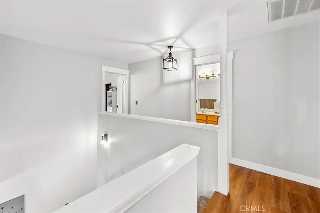 a bathroom with a shower a toilet and a window