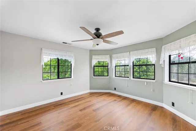 a living room with furniture and flowers
