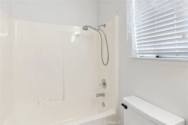 a swimming pool with outdoor seating and yard