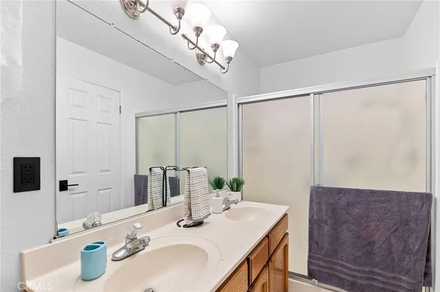 a view of a swimming pool with a patio and a garden