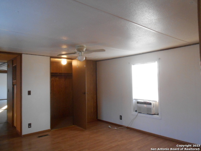 5420 Uecker Road San Antonio, TX 78220 - Photo 20 of 23 an empty room with windows and closet