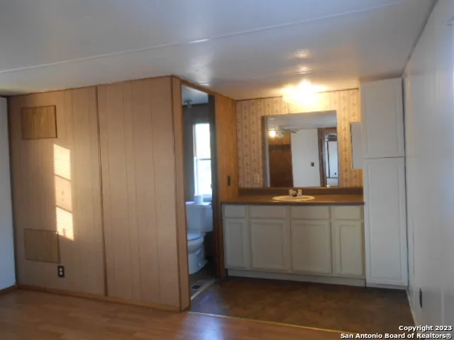 a bathroom with a sink and mirror