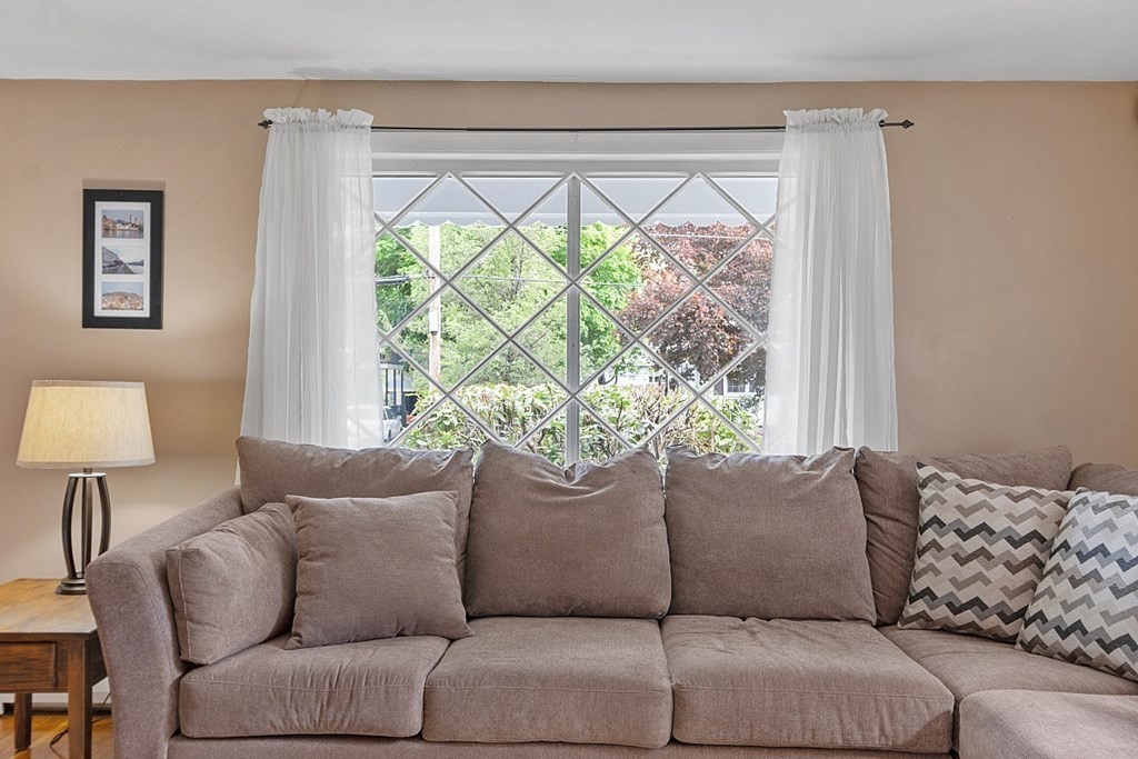 74 Viola Street Lowell, MA 01851 - Photo 16 of 35 a living room with furniture and a large window