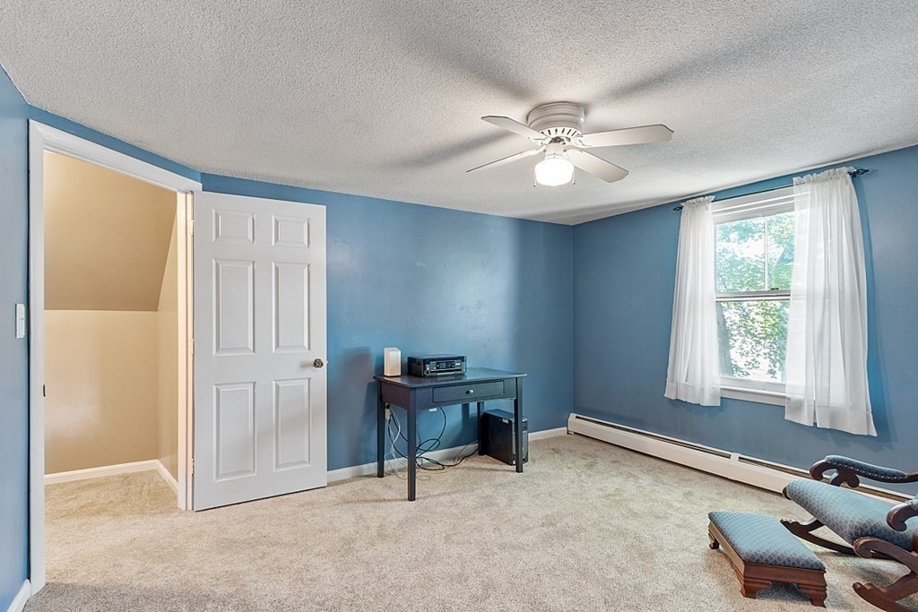 74 Viola Street Lowell, MA 01851 - Photo 29 of 35 a view of a workspace with furniture and a window