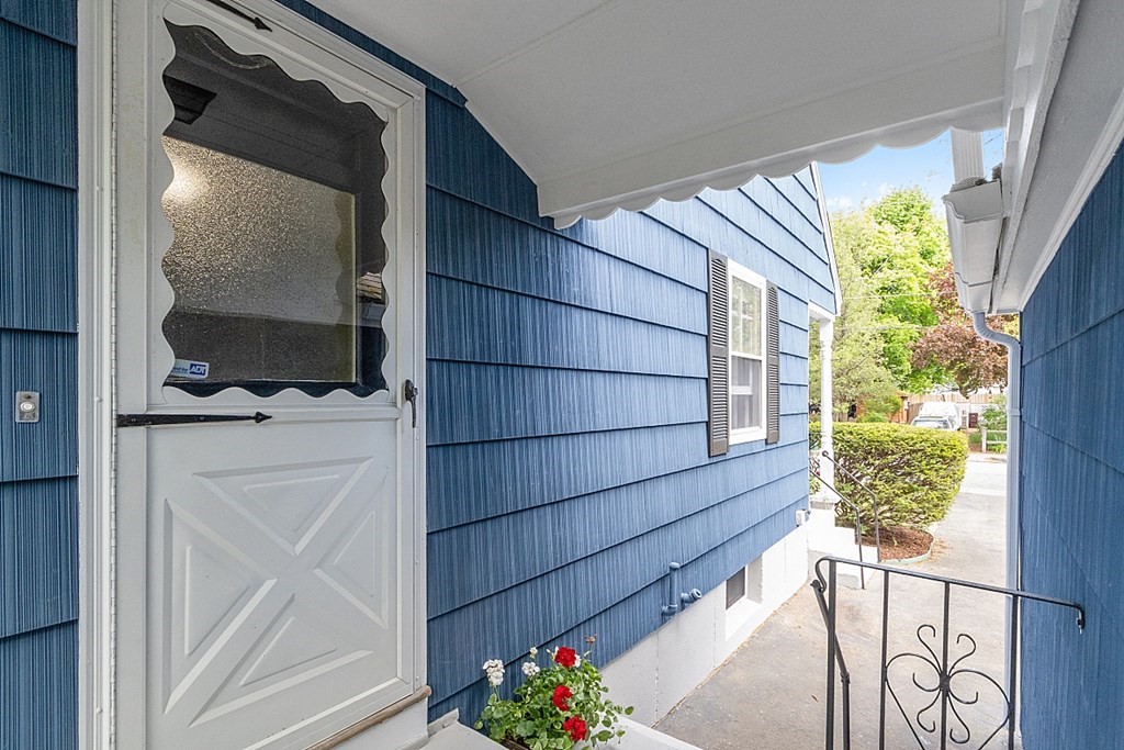 74 Viola Street Lowell, MA 01851 - Photo 6 of 35 a view of front door and wooden floor