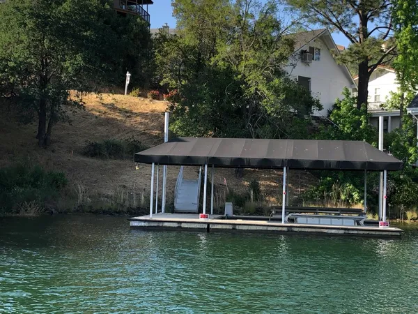a view of a swimming pool with outdoor seating